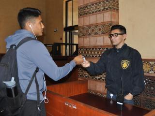CSO officer checking a student's ID
